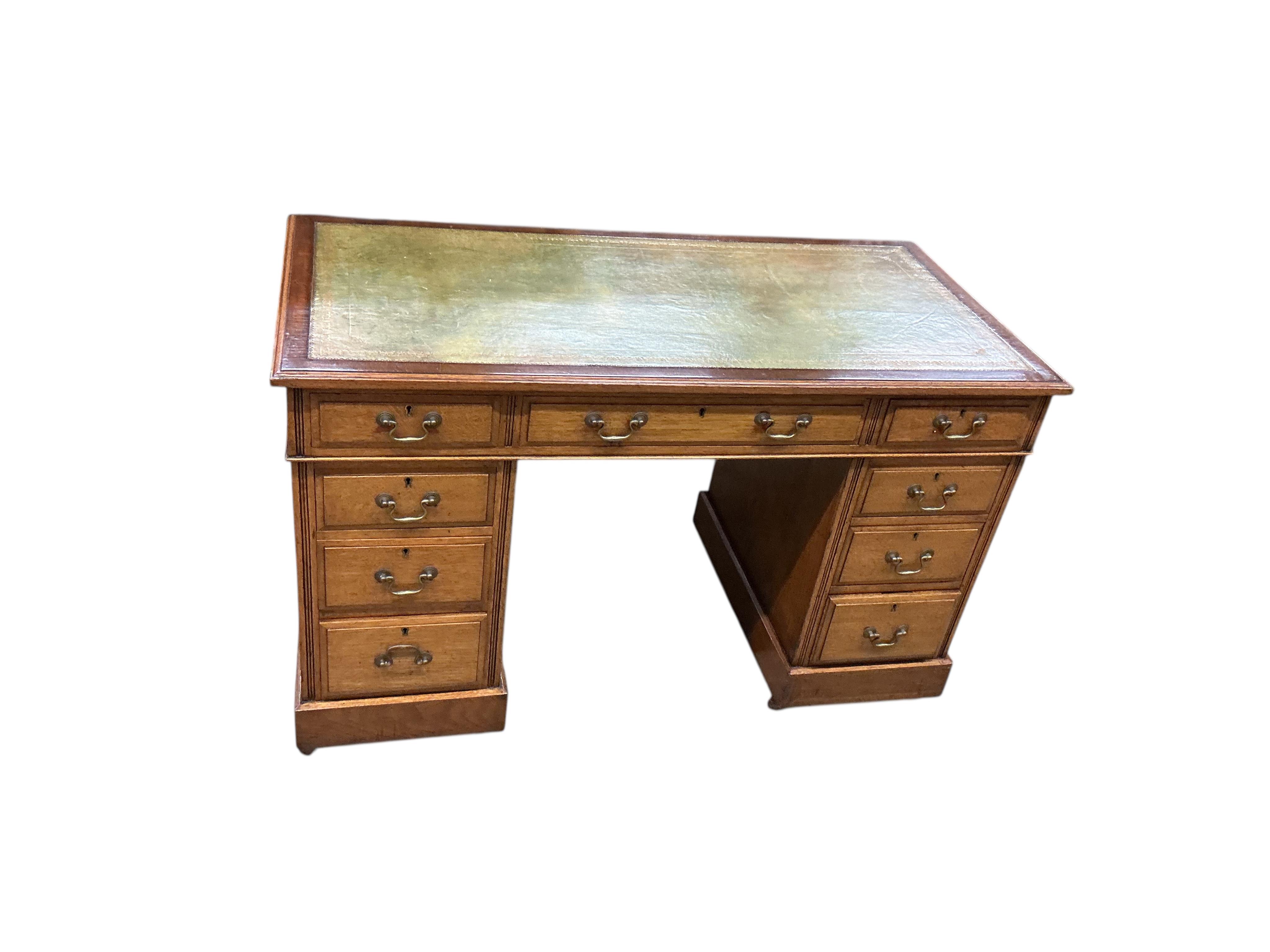 An early 20th century oak pedestal desk, width 122cm, depth 60cm, height 75cm